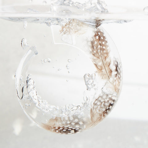 CHARÁ FEATHERS inside a water tank