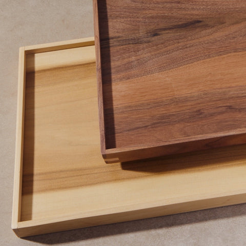 Two wood trays on top of each other.